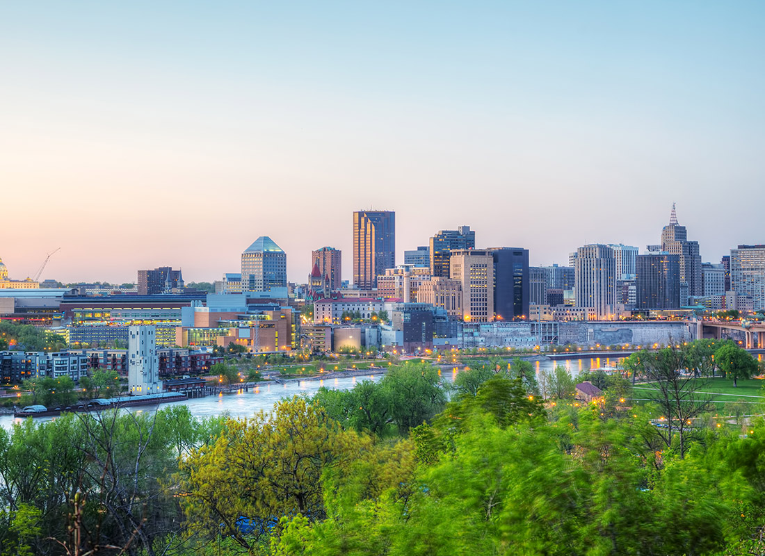 About Our Agency - Overview of Downtown St. Paul, MN With Park and River Nearby