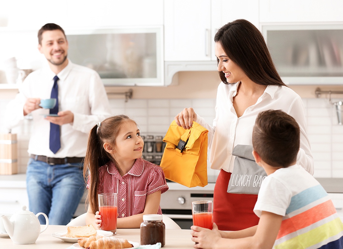 Personal Insurance - Happy Family Getting Ready for School and Work