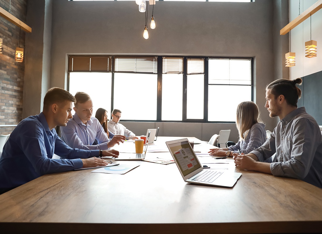 St. Joseph, MN - Young People Having Business Meeting in Modern Office