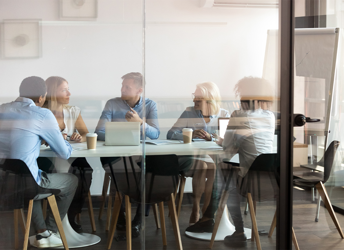 Fort Mill, SC - Business People Negotiating at Boardroom Behind Closed Doors